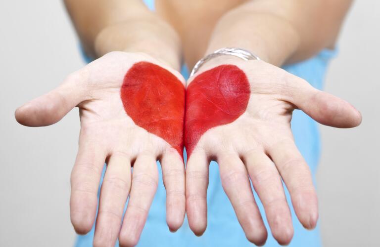 woman with hand painted on heart