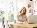 woman in house looking at computer
