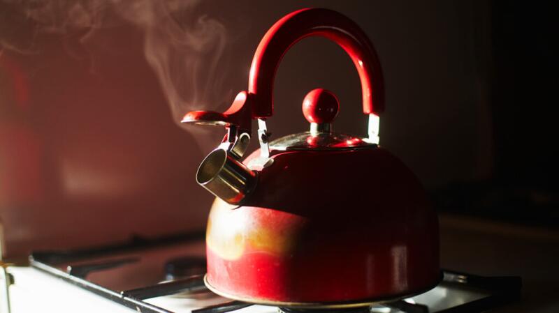 A kettle boiling on the stove