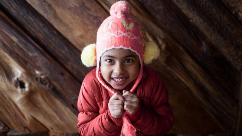 A child wearing a winter jacket