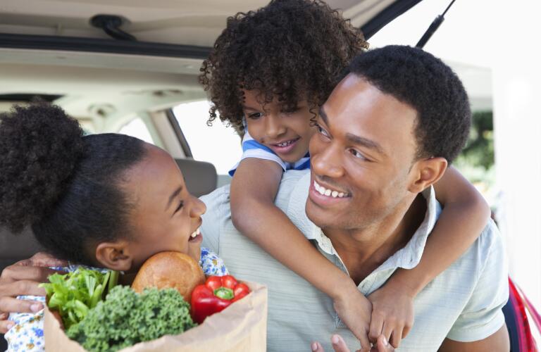 father-and-daughters-grocery-shopping