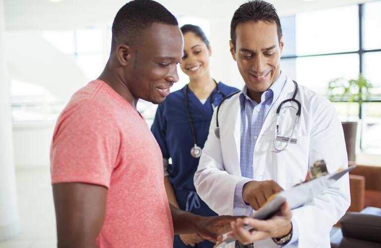 male-patient-speaking-with-male-doctor