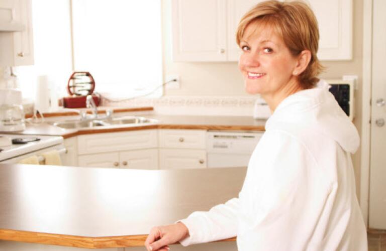Smiling woman in kitchen