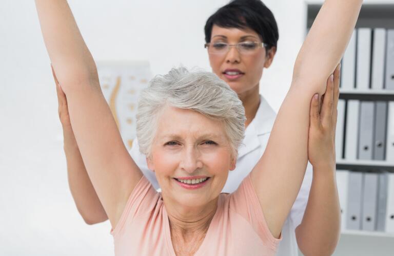 woman-stretching-arms-above-head-with-help