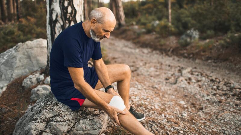 A man with a bandage on his leg