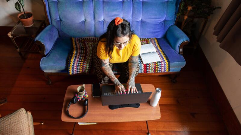 A person is researching on a laptop.
