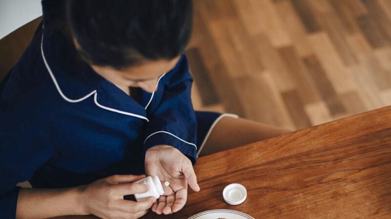 a person with ulcerative colitis is taking pills