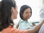 Woman having mammogram performed