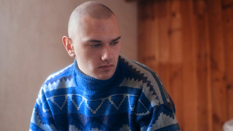 Young man looking away in thought or concern