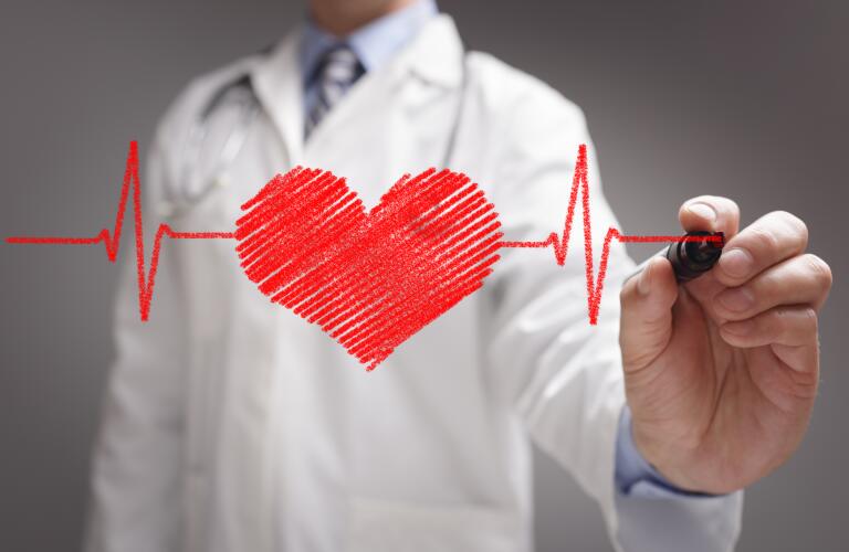 doctor-drawing-ecg-over-cartoon-heart