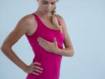 woman-performing-self-breast-exam