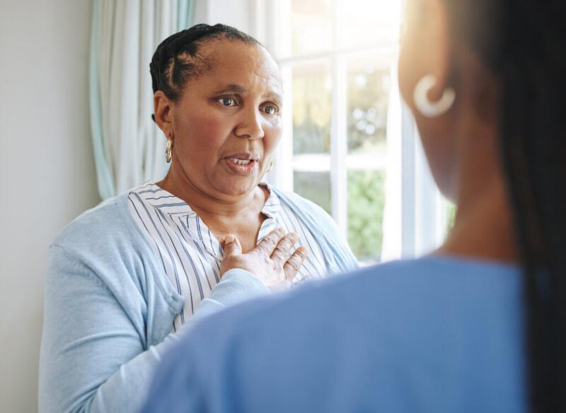 Black female patient speaking to nurse
