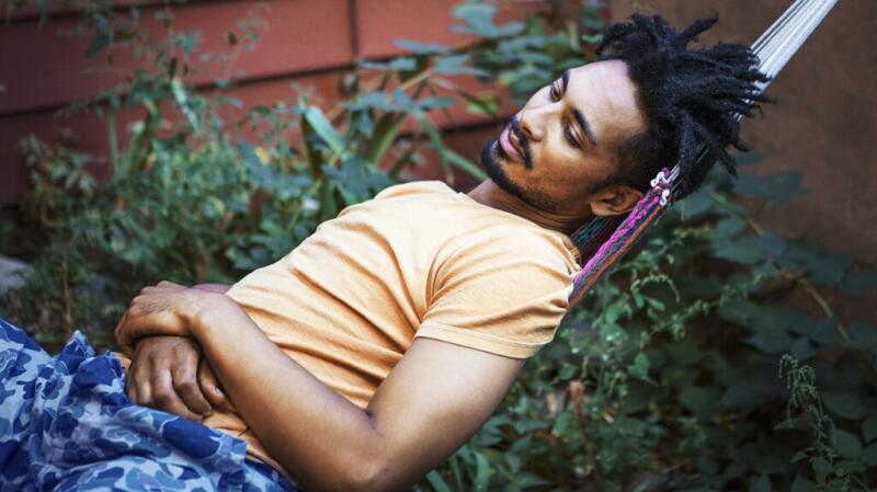 Male lying in a hammock